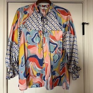 Women’s flowy print blouse with balloon sleeve and ruffle detailing